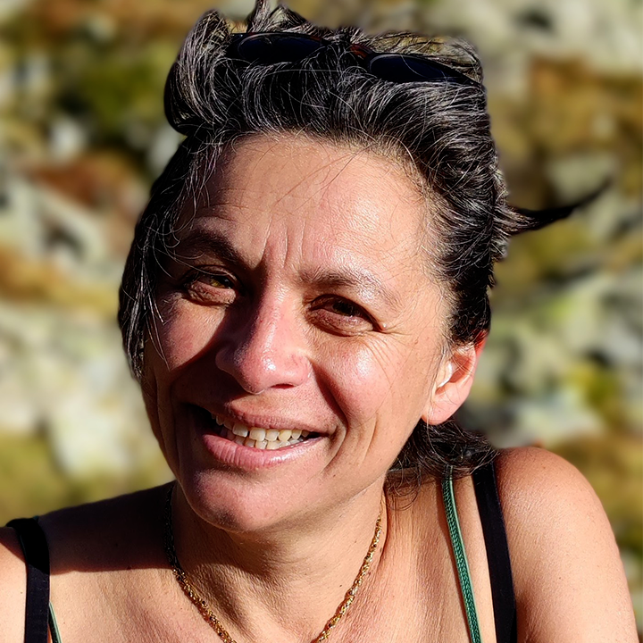 Barber 1 young man with beard smiling and wearing a  brown shirt
